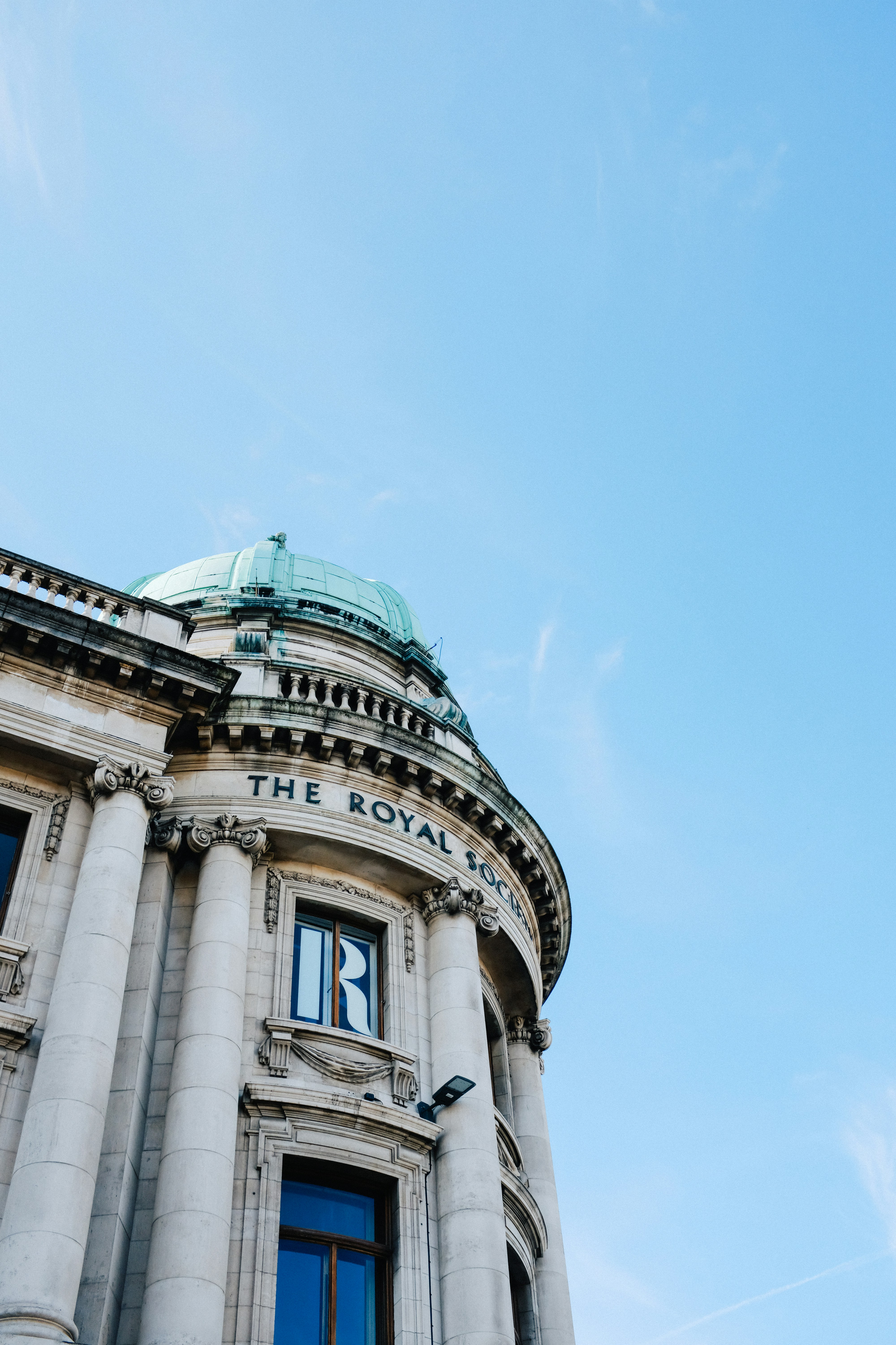 a building with a dome and columns
